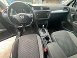the interior of a car with a steering wheel and dashboard controls