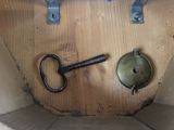 a picture of a wooden box with a key and a lock
