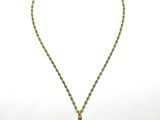 a gold necklace with a cross on a chain on a white background