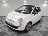 a picture of a small white car on a checkered floor