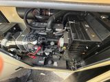 a picture of a car ' s engine in the back of the car