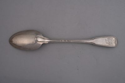 a spoon and a spoon rest on a table