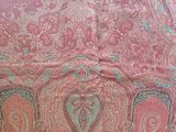 an image of a pink and green paisley print fabric