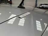 a car with a sticker on the hood of it