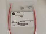 a close up of a pair of red wires on a white surface