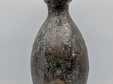 an image of a statue of a woman with a hat on her head