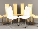 four chairs are arranged in a circle on a gray surface