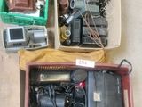 a box of assorted items sitting on the floor
