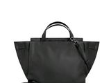 a black handbag with a black strap and a white background