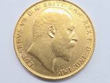 an image of a close up of a gold coin on a white surface