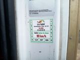 a sign on the door of a bus that says exit
