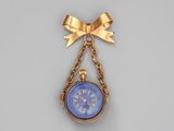 an image of a gold and blue pocket watch hanging from a chain