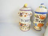 three vases with different designs on them on a table