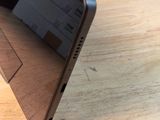 a wooden table with a laptop on top of it