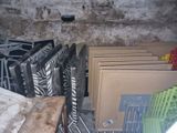 many pieces of furniture in a room with a dirty wall