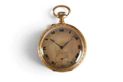 a gold pocket watch with roman numerals on the face