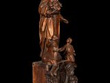 an image of a statue of a woman holding a child