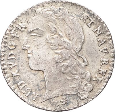 une pièce d'argent portant une tête de femme