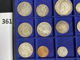 a display case with a variety of coins in it