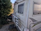 a white rv parked on the side of the road
