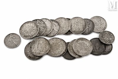 an image of a pile of silver coins on a white surface