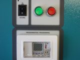 a close up of a control panel on a blue wall
