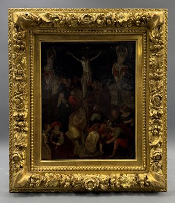 une image représentant un tableau de Jésus sur la croix, dans un cadre doré