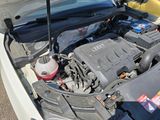 a car engine with its hood open on the street