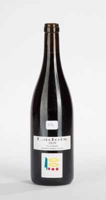 a bottle of wine that is sitting on a table