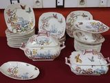 a lot of plates and bowls on the table
