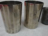 two cups sitting next to each other on a table