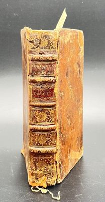 an old book that is sitting on a table