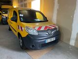 a yellow van that is parked in a garage