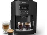 a coffee machine with two cups of coffee next to it