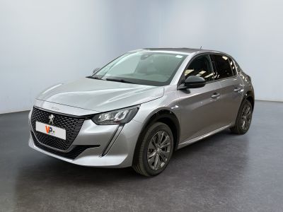 the silver car is parked in a large room with a black floor