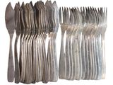 a lot of forks and spoons that are stacked together