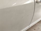 a close up of a car door handle and the door handle is missing
