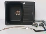 a picture of a kitchen sink with a hose attached to it