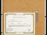 an image of a picture of a certificate hanging on a bulletin board
