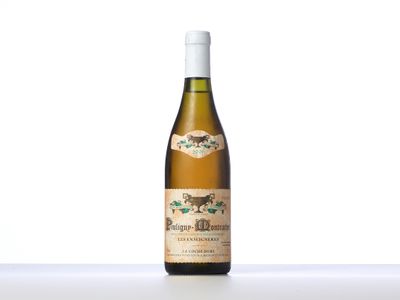 a bottle of white wine sitting on top of a table