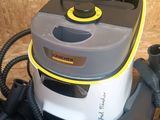 a vacuum that is sitting on the floor next to other items