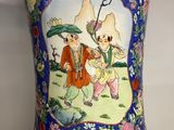 a vase with a picture of a man and a woman on it