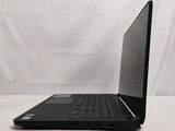 a black laptop computer sitting on a white surface