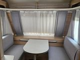 a small table in the corner of a camper