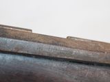 an image of a close up of a gun on a table