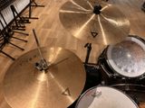a close up of a drum set on a wooden floor