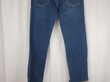 the back of a pair of jeans hanging on a hanger