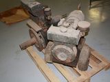 a small engine that is sitting on a pallet