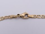 a gold chain bracelet with a clasp on a white background