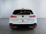 the rear end of a white car in a white room